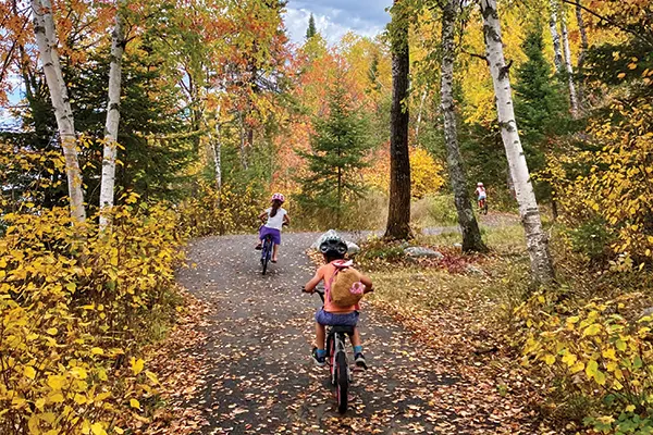 Kids bike along the accessible portion of Rabbit Lake Trail.