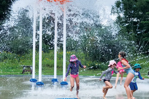 Kids playing at the splash park at Norman Beach.