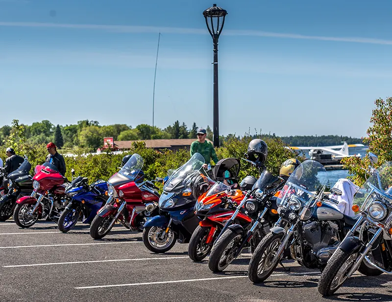 Motorcycles parked in a row along the Kenora Harbourfront.